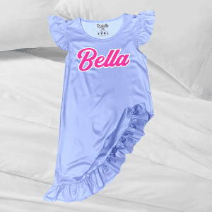 Pink "Bella" script graphic on light blue ruffled baby girl dress, perfect for personalized children's apparel.
